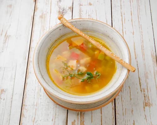 Minestrone soup with salmon